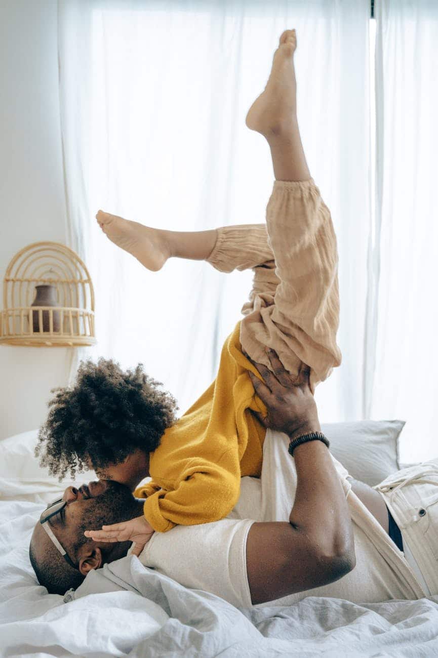 man playing with his child