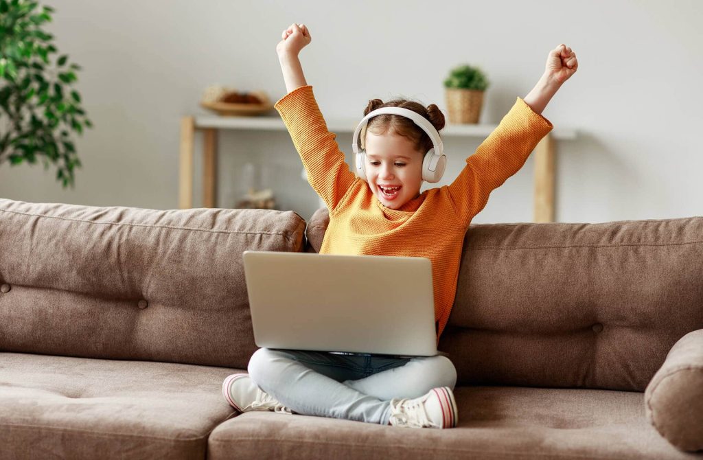 Girl excited about listening to a free audiobook for kids