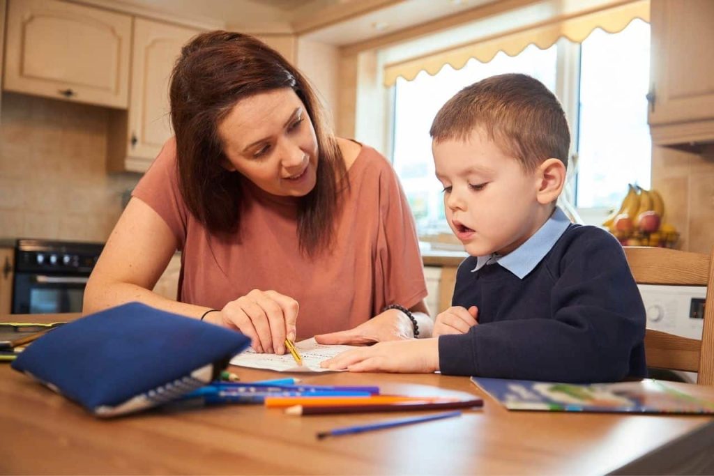 A tutor helping their student with phonological awareness